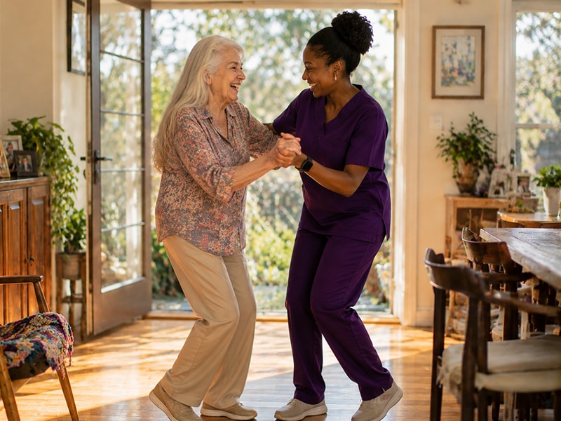 Caregiver helping an older adult and their family enjoy a shared hobby at home.